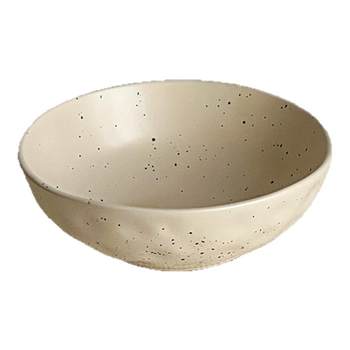 Pinch sesame seeds in hand and order irregular soup bowls and salad bowls
