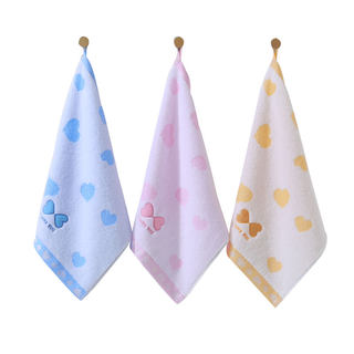 Goldfarbenes handtuch für das gesicht aus reinem, ungezwirntem baumwollgarn