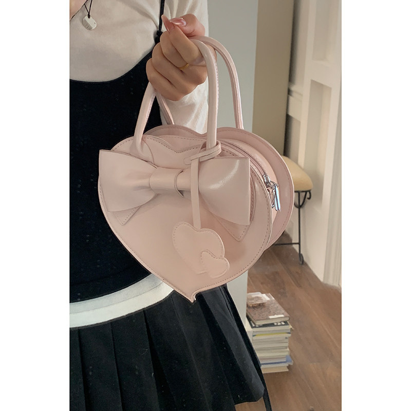 Korean style red handbag for women, new 2025, trendy, sweet, bow-knot heart-shaped bag, versatile crossbody bag.