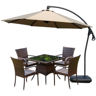 Outdoor patio rattan tables and chairs with umbrellas and parasols