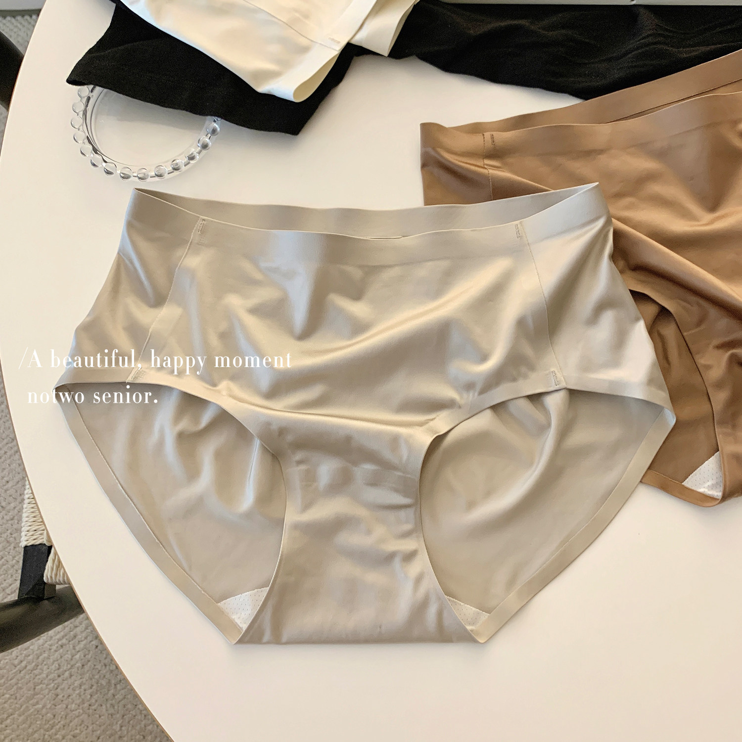 Luxury satin ice silk seamless panties for women, 2026 new style, high-end one-piece design, mid-waist, breathable.
