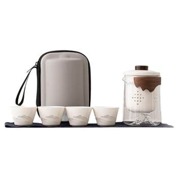 A pot and three cups of travel tea sets for thousands of miles