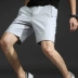 Quần short thể thao nam mùa hè quần short mùa hè năm điểm 5 Quần skinny đi biển Quần dài nam 2018 mới quần baggy nam Quần short