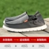 2019 xuân mới giày thể thao thoáng khí nam cũ Bắc Kinh trẻ giản dị vải lười mềm dưới chân một bàn đạp giày nam thể thao Plimsolls