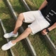Quần short nam mùa hè màu rắn năm điểm quần short giản dị kích thước lớn quần bãi biển bên ba thanh quần ống quần nam triều quần short jean nam