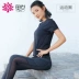 Aoyi quần áo yoga mùa xuân và mùa hè nữ ngắn tay thon gọn thể thao Yoga