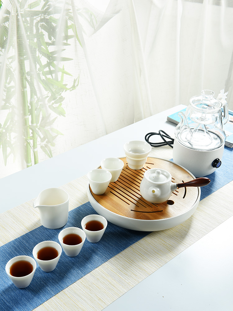 The cabinet dehua white porcelain kung fu tea set home office contracted dry tea plate glass ceramic electric TaoLu suits for