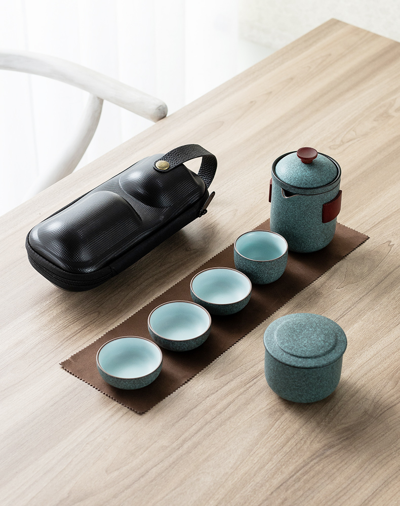 Black pottery travel tea set four cups with a pot of tea pot set portable receive a crack cup car outside BaoHu kung fu