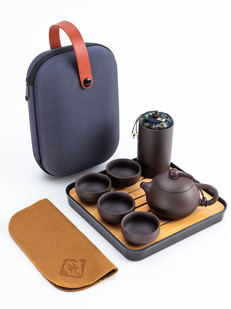 Violet arenaceous a pot of four cups of portable car travel tea set is suing the receive packets contracted to crack a cup of tea tea tray