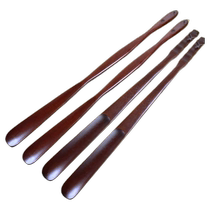Solid wood shoehorn with long handle for pregnant women to wear shoes at home with extended handle to lift shoes and slide shoes for the elderly without bending over.