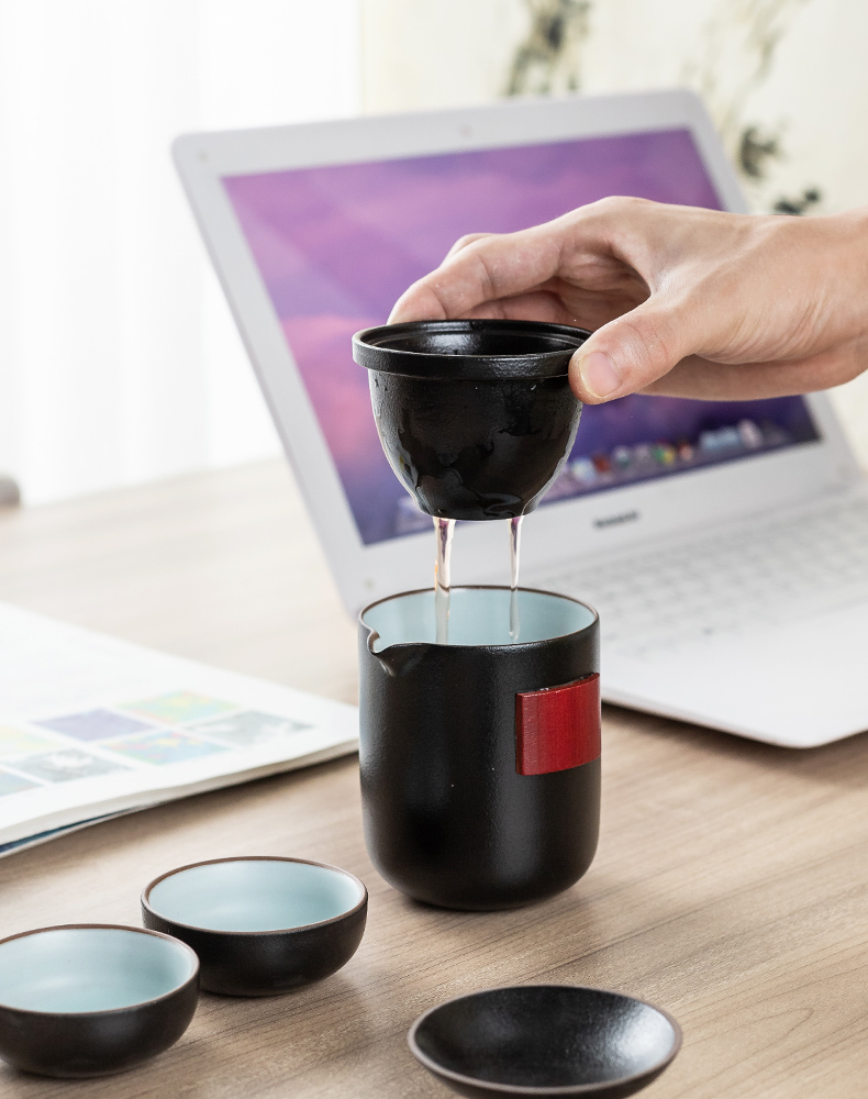 Black pottery travel tea set four cups with a pot of tea pot set portable receive a crack cup car outside BaoHu kung fu