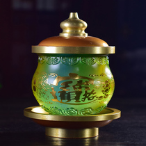 There is a Buddha with glass holy water cup for the Buddha God of Wealth Guanyin water purification cup Buddha Hall Buddha front offering cup indoor retro