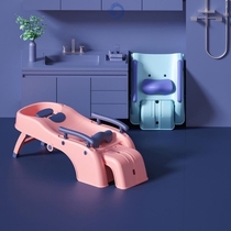 The baby lies in the wash basin small child wash the hair deckchair three-year-old home elderly pregnant woman the adult washing the head bed can be folded
