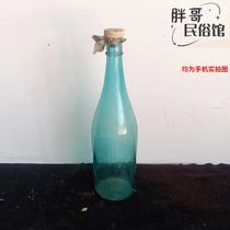 Old object peacock blue glass bottle in the 1980s nostalgia decorated blue bottle old antique collection shooting props