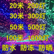 Glowing light bulbs hanging on the tree with colorful lights color household string lights full of stars atmosphere small flash lights with led colorful change