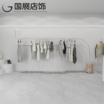 New high-end clothing store display rack shelf with wooden pile stone base stainless steel clothes rail creative fashion