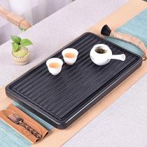 Wujin Stone tea tray natural small large stone tea tray drainage stone Black Gold Stone Tea Sea simple household tea table