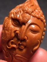 A string of pure handmade olive nuclear sculptures.