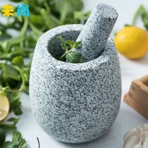 Mashed garlic jar with a ring of chilli Knoll and mortar knocks the garlic and the thunder bowl of the old natural allured pepper of the household stone mortar.