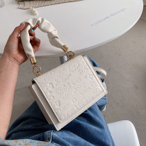 Singapore womens bag 2021 new Korean version fine with embossed genuine leather fashion single shoulder inclined satchel girl texture small square bag