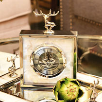 Simple modern high-end table clock European living room Metal silver creative table clock Shell deer table clock New product