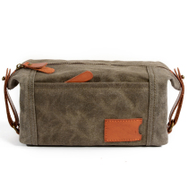 Qiguxi new tide men and women's hand bag wax cloth with colored leather finishing bag cosmetic bag casual hand bag