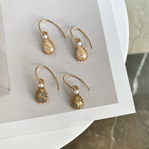 Temperament retro light luxury transparent gold foil drop pendant earrings cold wind imitation pearl niche design Net red ear ornaments