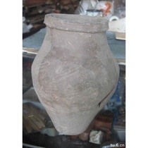 A real antique a real old pottery collection an old piece of pottery a notched pottery bottle