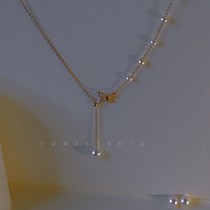 Necklace 2021 New female butterfly knot Y-word pearl refined collarbone chain light lavish lukewarm wind retro