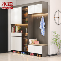 Entering shoe cabinet is integrated against the wall