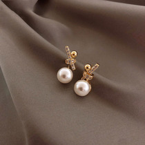 Commuter earrings 2021 New Tide Korean temperament sterling silver short earrings female super fairy bow pearl earrings