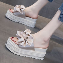 Summer slippers female 2022 new Korean version thick bottom pine pastry butterfly knot heightening outside wearing beach sandals