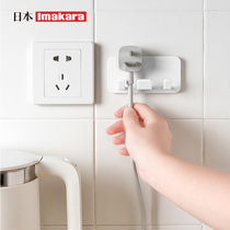 Electrical power plug adhesive hook kitchen traceless wire storage pylon creative non-perforated strong paste Wall Wall wall hanging