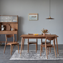 Modern minimalist dining table and chairs combined Nordic style light and luxurious black walnut wood rectangular full solid wood household small family