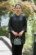 Mother in a fragrant cloud-yarn blouse with a long summer