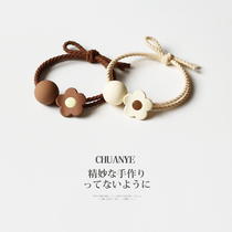 Sichuan wild flower beaded leather band female tie head Japanese and Korean simple head rope 2021 New Japanese and Korean temperament Hairband hair rope