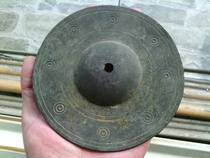 A copper ware clutter with a piece of