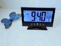 Voice-activated backlight Temperature display Timer display Perpetual calendar with alarm and snooze function