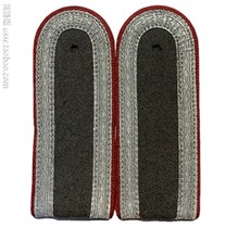 A pair of shoulder insignias of a Stasi corporal of the East German Democratic Republics Ministry of State Security