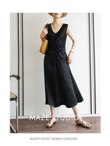Maze Studios is so elegant that you dont even know yourself in a draped black V-neck skinny dress