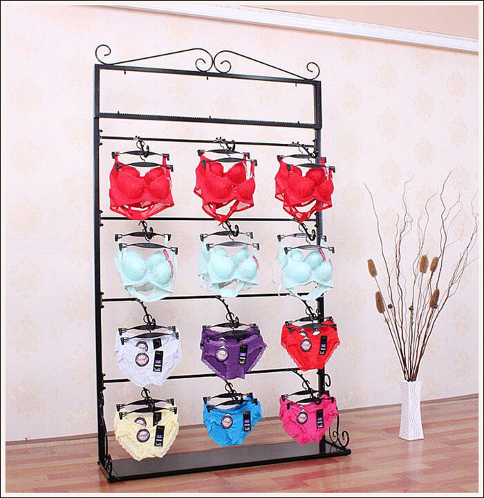 Iron Art Metal Briefs Bra rack floor with plate leaning against wall lingerie hanging on the island shelf