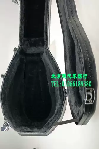 Современный музыкальный инструмент черный деревян