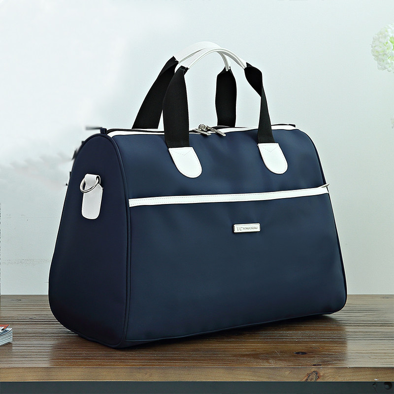 Solid color travel bag portable large-capacity waterproof luggage bag short-distance travel business boarding cover trolley net red - Taobao