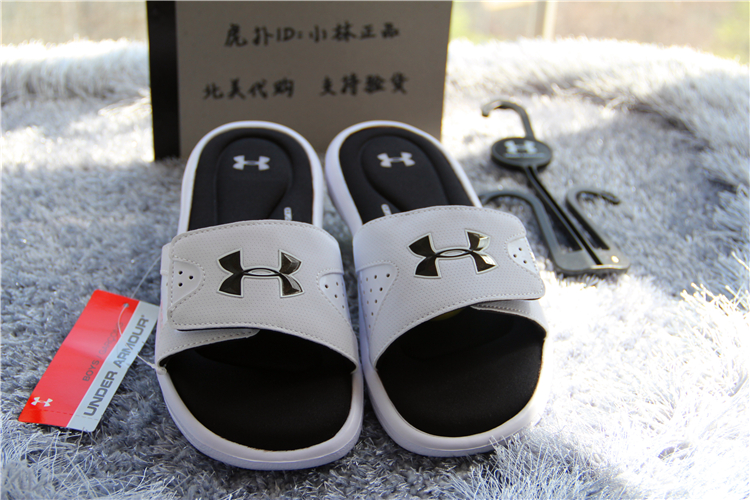 Mỹ mua lại dưới áo giáp Một Dema UA nam giới và phụ nữ thể thao dép IGNITE màu đen và trắng dép havaianas chính hãng