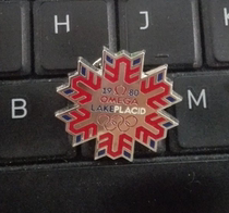 2010 Vancouver Winter Olympics Badge Omega Badge 1980 American Serenity Lake Winter Olympics Snowflake Badge