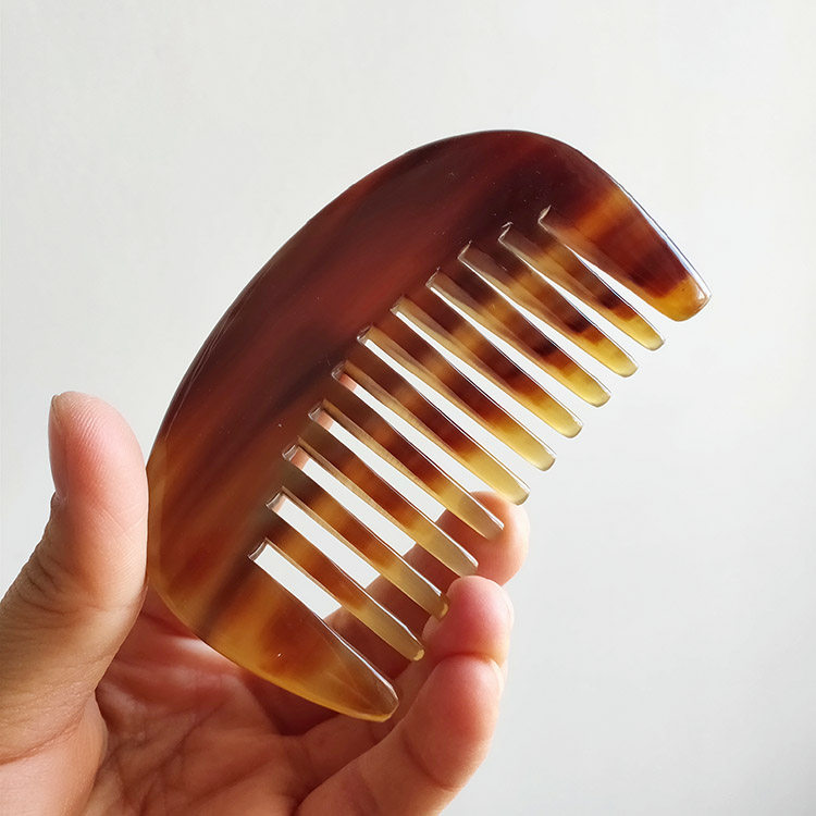 Seven grids show red and white buffalo horn comb Wide teeth big teeth roll hair massage comb Round massage comb