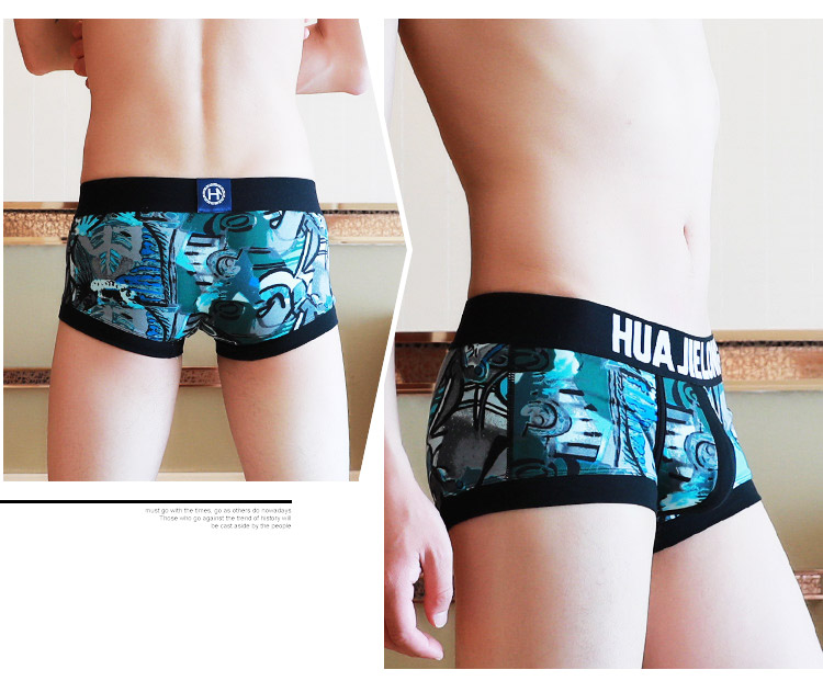 Đồ lót nam cotton thấp eo graffiti in boxer thủy triều nam U lồi túi thanh niên boxer quần short đầu quần sịp doremon