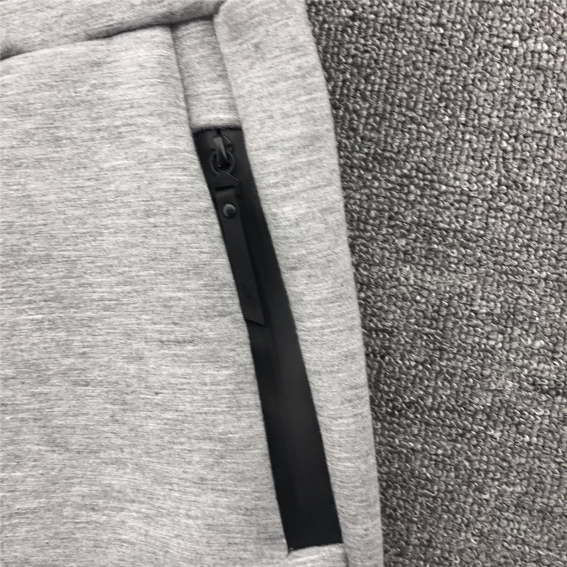 Fanzi Shangpin Đảo xuất khẩu Quốc gia U Không gian nhà Vải Cotton Màu rắn nhiều màu Không thấm nước Zipper nam Chân co lại quần jean nam rách