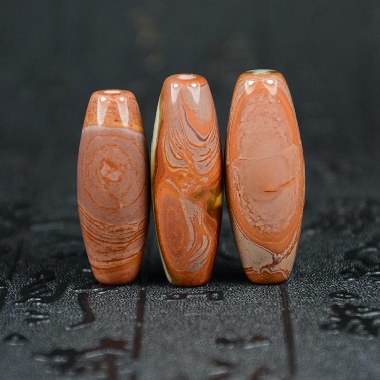 Ocean Jasper nine-eyed shale Tibet genuine Tianzhu rough stone Tianyan Lezi Chalcedony Jade Evil Buddha Bead pendant pendant pendant