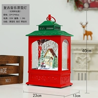 Древняя маленькая снежная музыка освещает красный и зеленый счастливый снежный дом